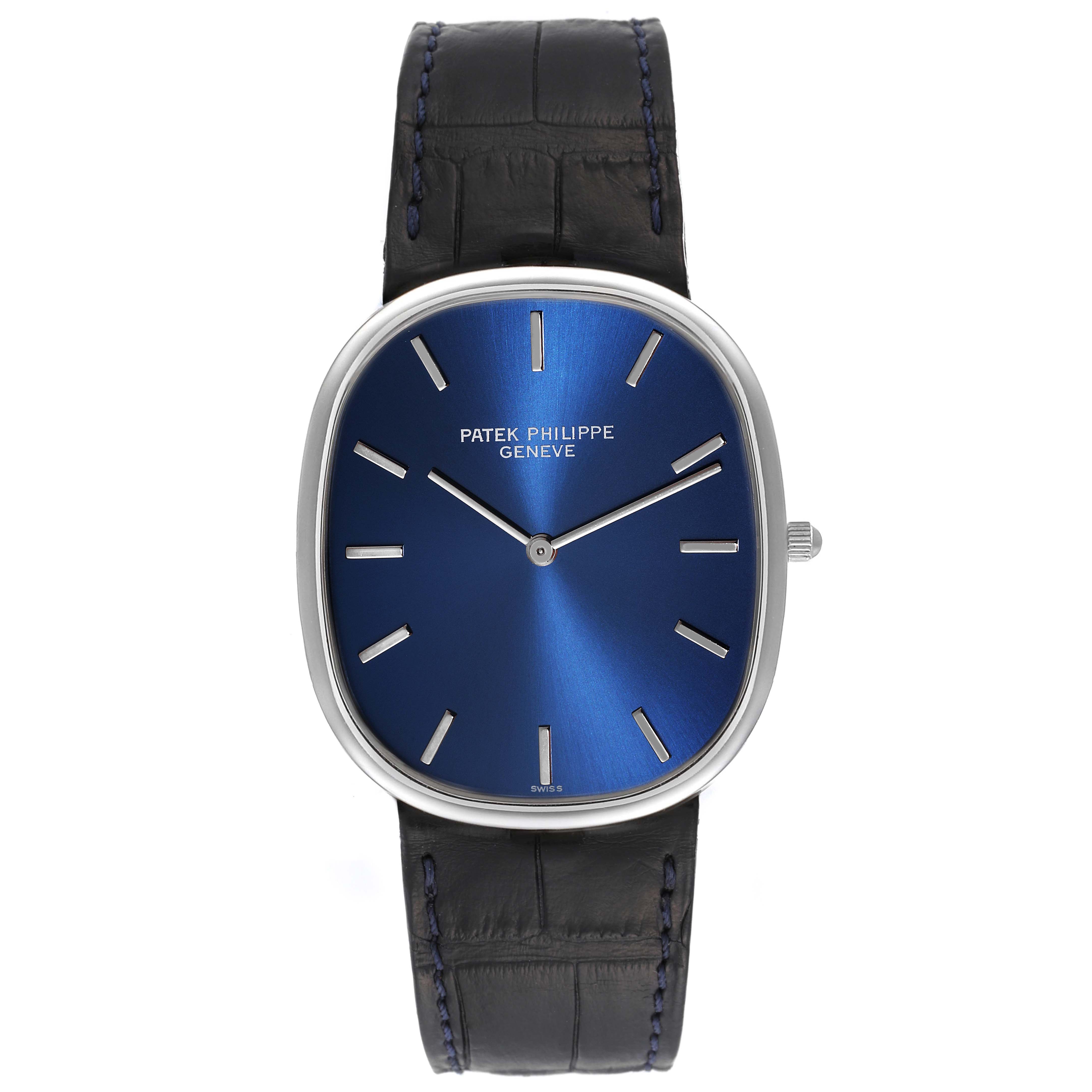 The image shows a front view of the Patek Philippe Golden Ellipse 5738P-001 Men's Platinum Blue Dial 5738P-001 Men's Platinum Blue Dial watch, including its blue face, silver hands, and black strap.