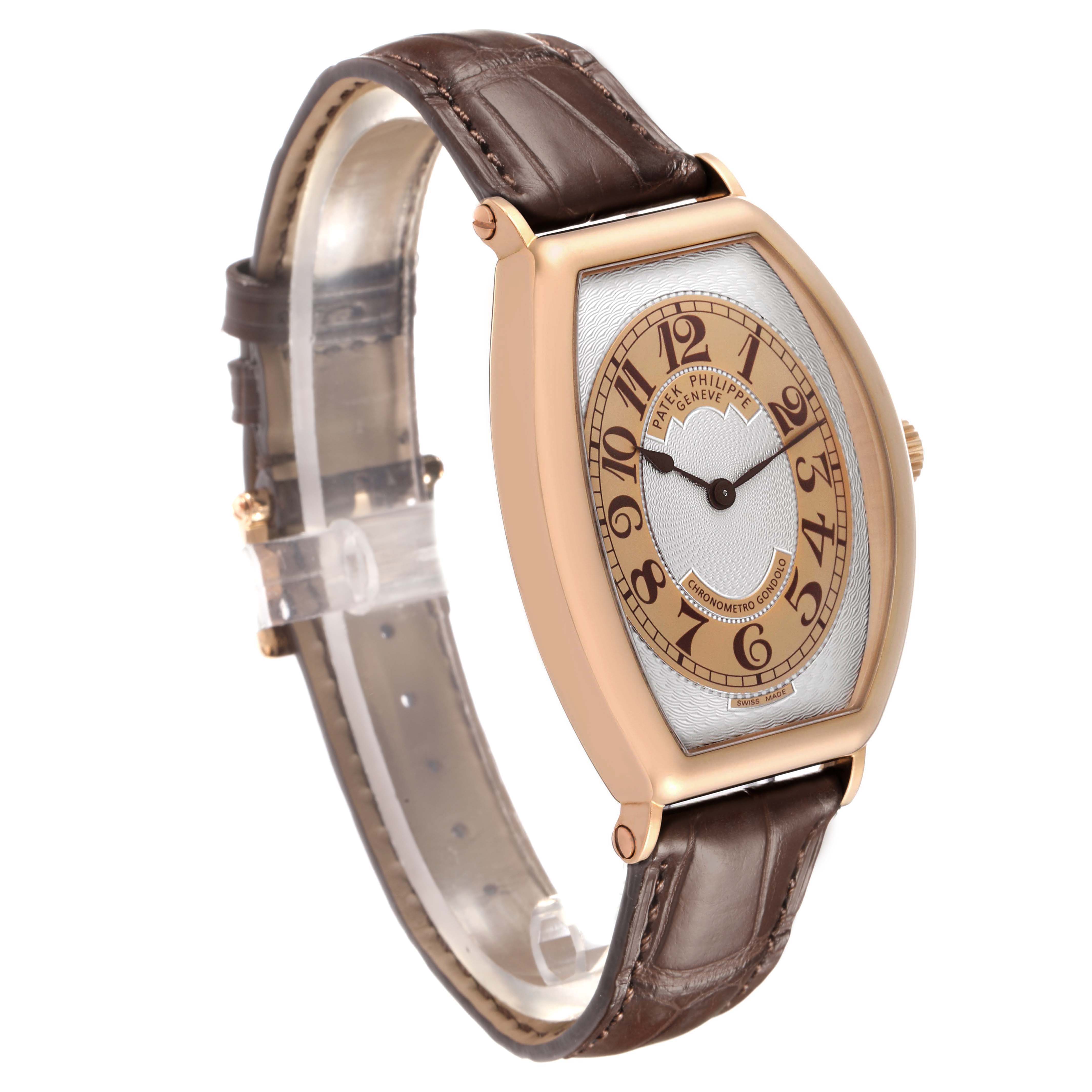 The Patek Philippe Gondolo 5098R Men's Rose Gold Silver Dial watch is shown at an angle, highlighting its oval dial, brown leather strap, and rose gold case.
