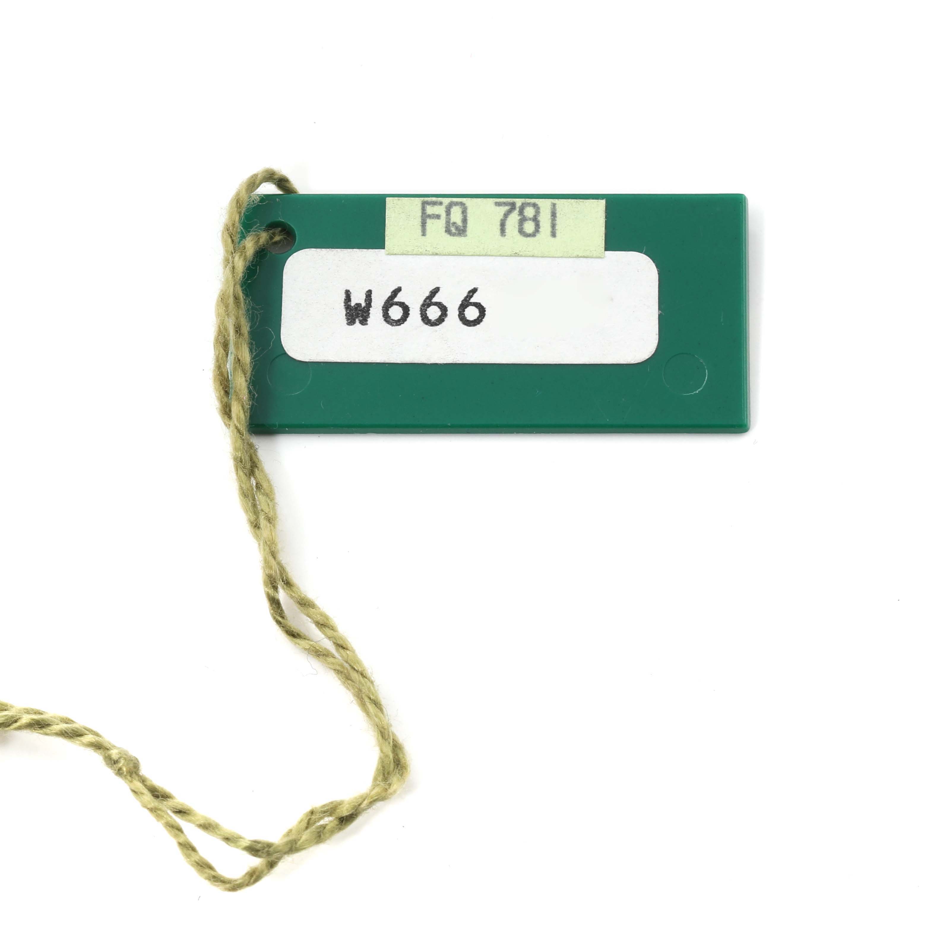 This image shows the green tag for a Rolex Air-King 14000 Men's Stainless Steel Blue Dial 14000 Men's Stainless Steel Blue Dial watch, featuring numbers "FQ 781" and "W666".