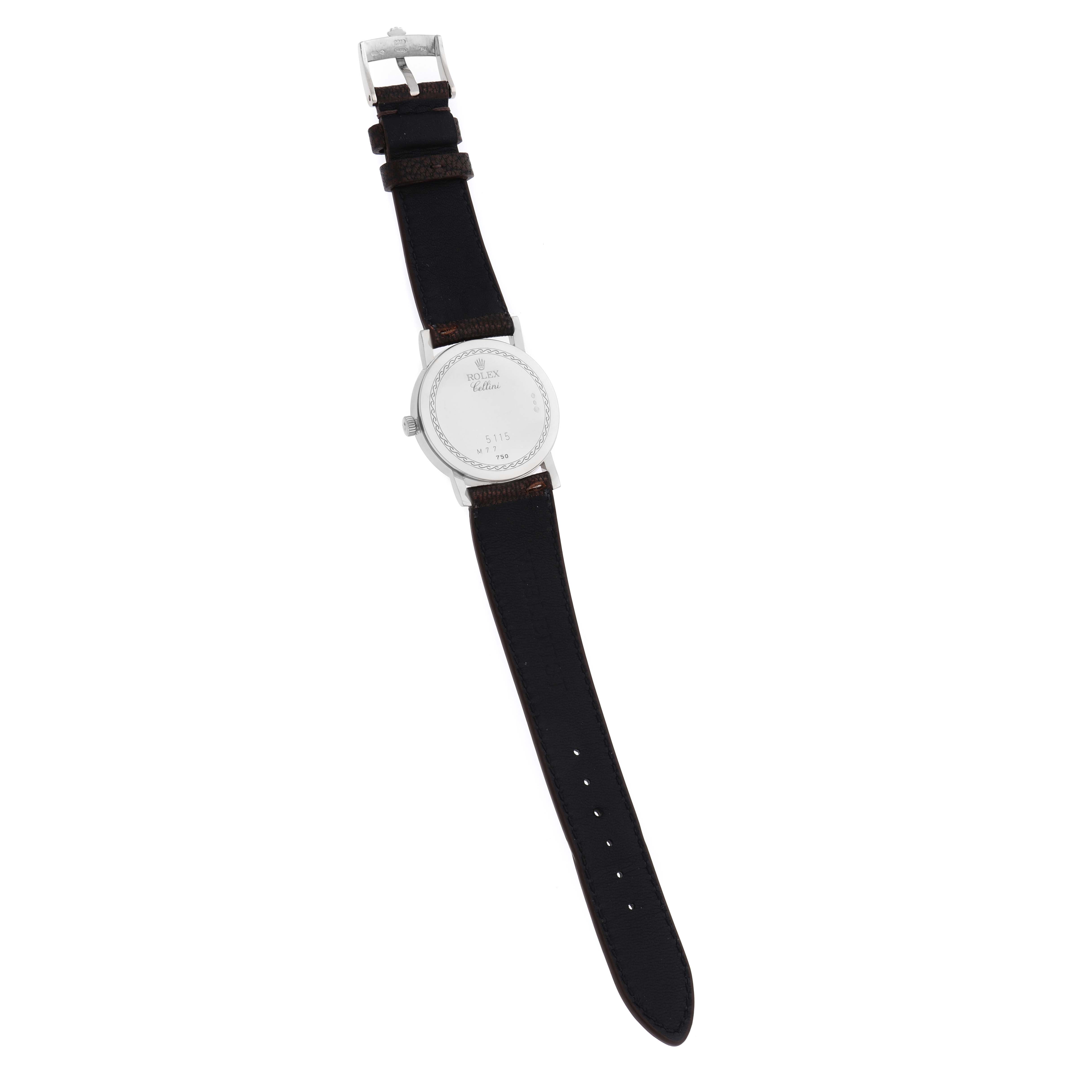 The Rolex Cellini 5115 Men
s White Gold Silver Dial watch is shown from the back, displaying the case back and leather strap with buckle.