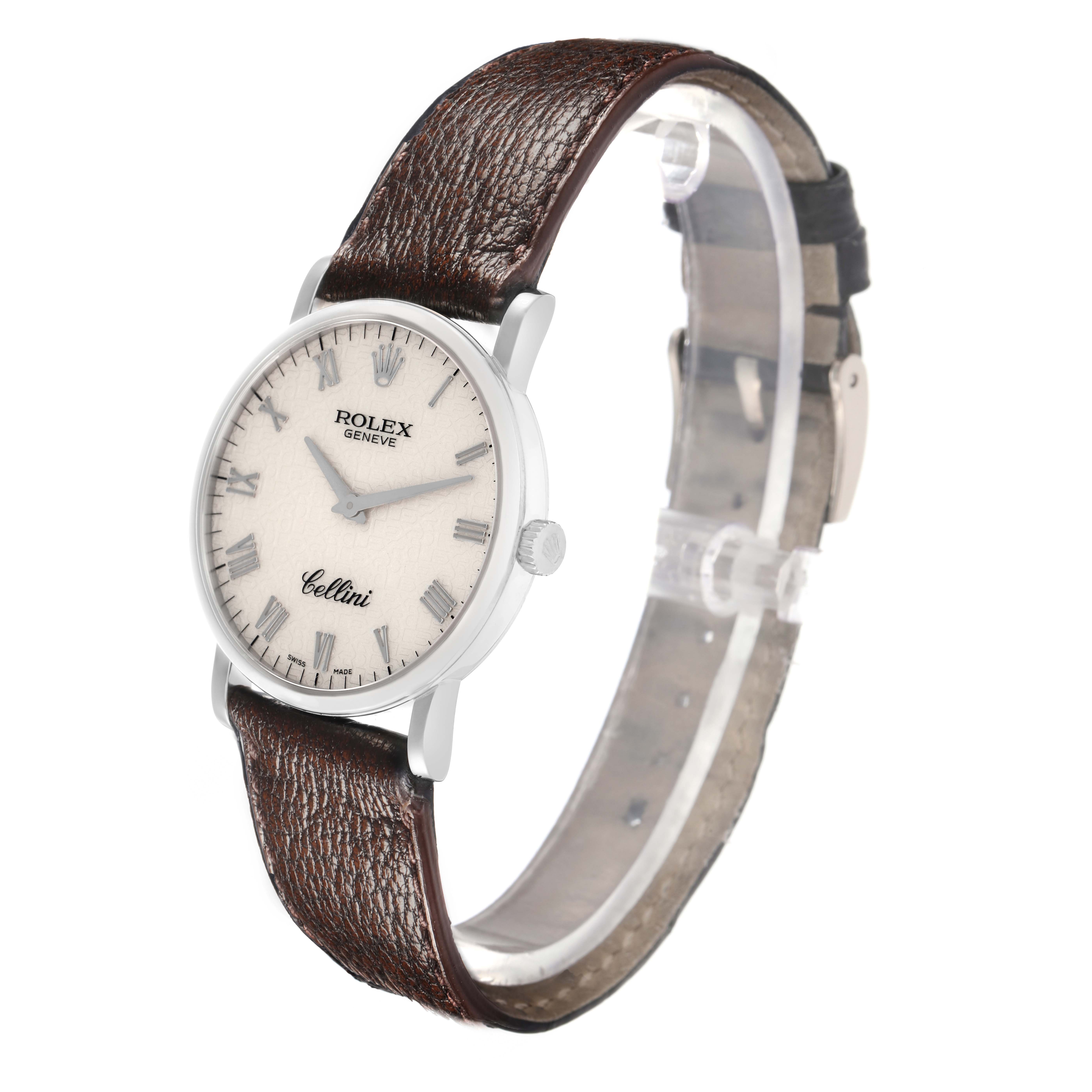 The Rolex Cellini 5115 Men
s White Gold Silver Dial watch is shown at a slight angle, displaying its face, case, crown, and brown leather strap.