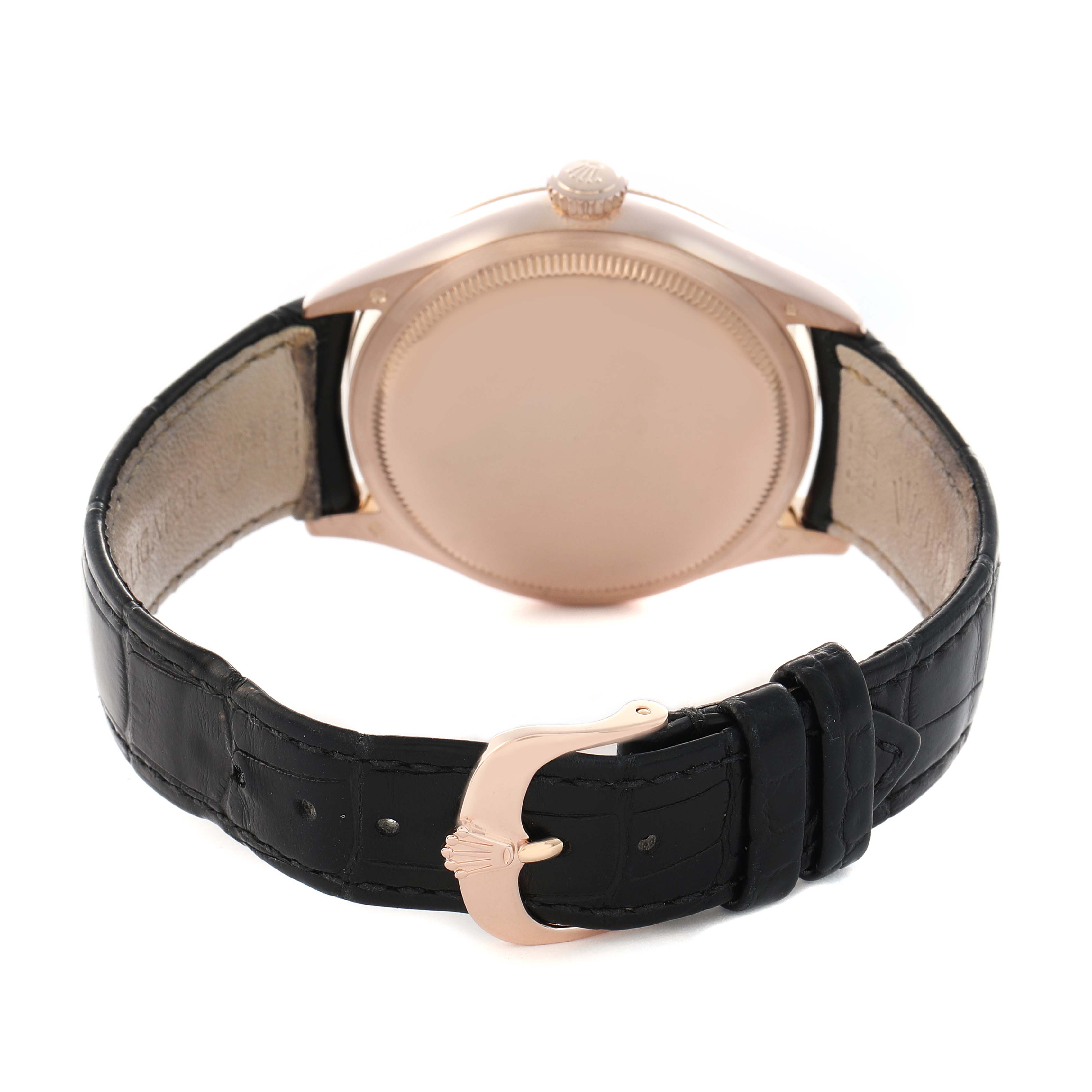 The image shows the back of a Rolex Cellini 50505 Men
s Rose Gold Black Dial watch and its leather strap with a metal clasp, viewed from a slightly elevated angle.