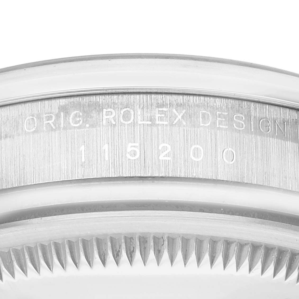 The image shows a close-up of the case with the engraving of the Rolex Date 115200 Men's Stainless Steel Black Dial 115200 Men's Stainless Steel Black Dial model 115200.