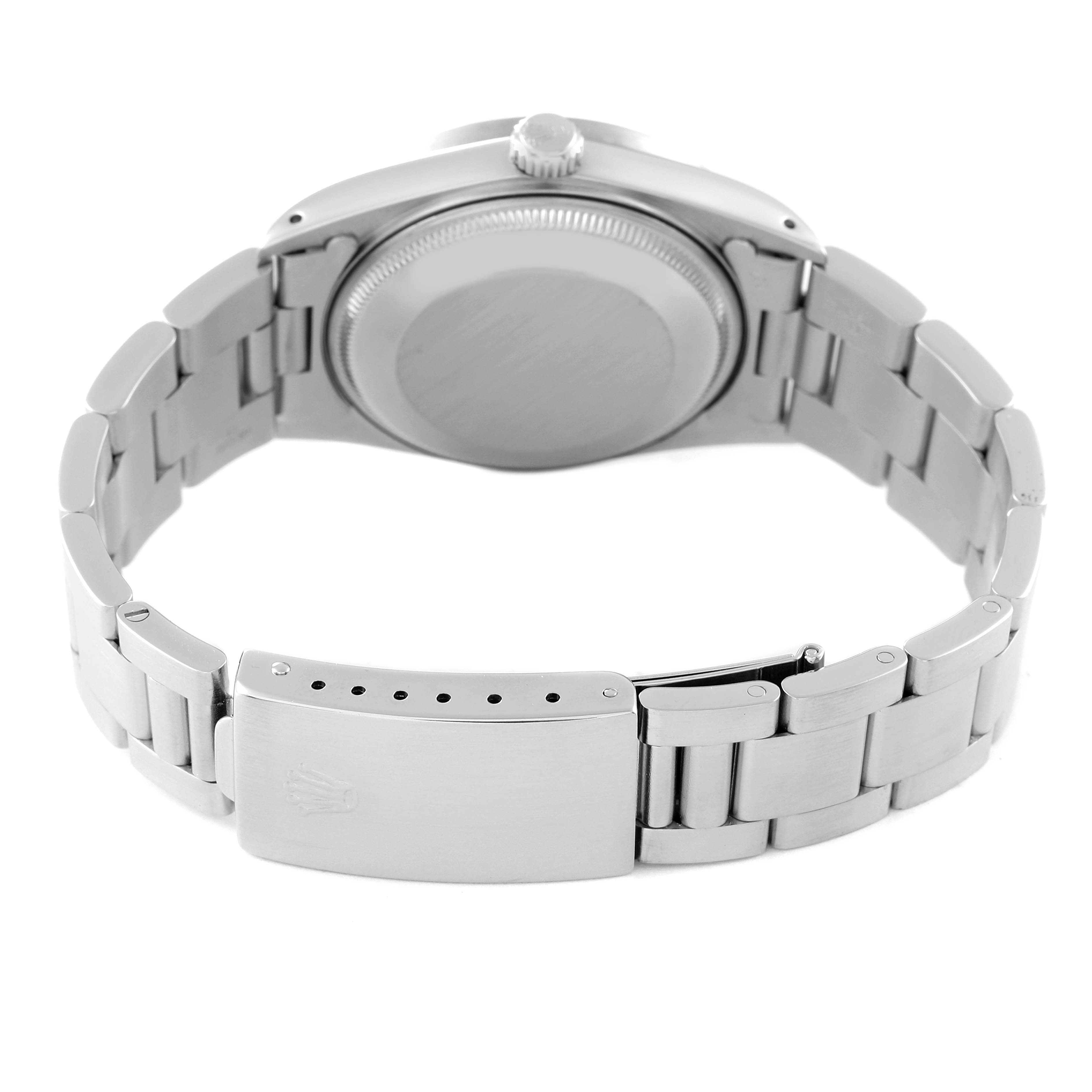 This image shows the back angle of a Vintage Collection Rolex watch, focusing on the clasp, bracelet, and case back.