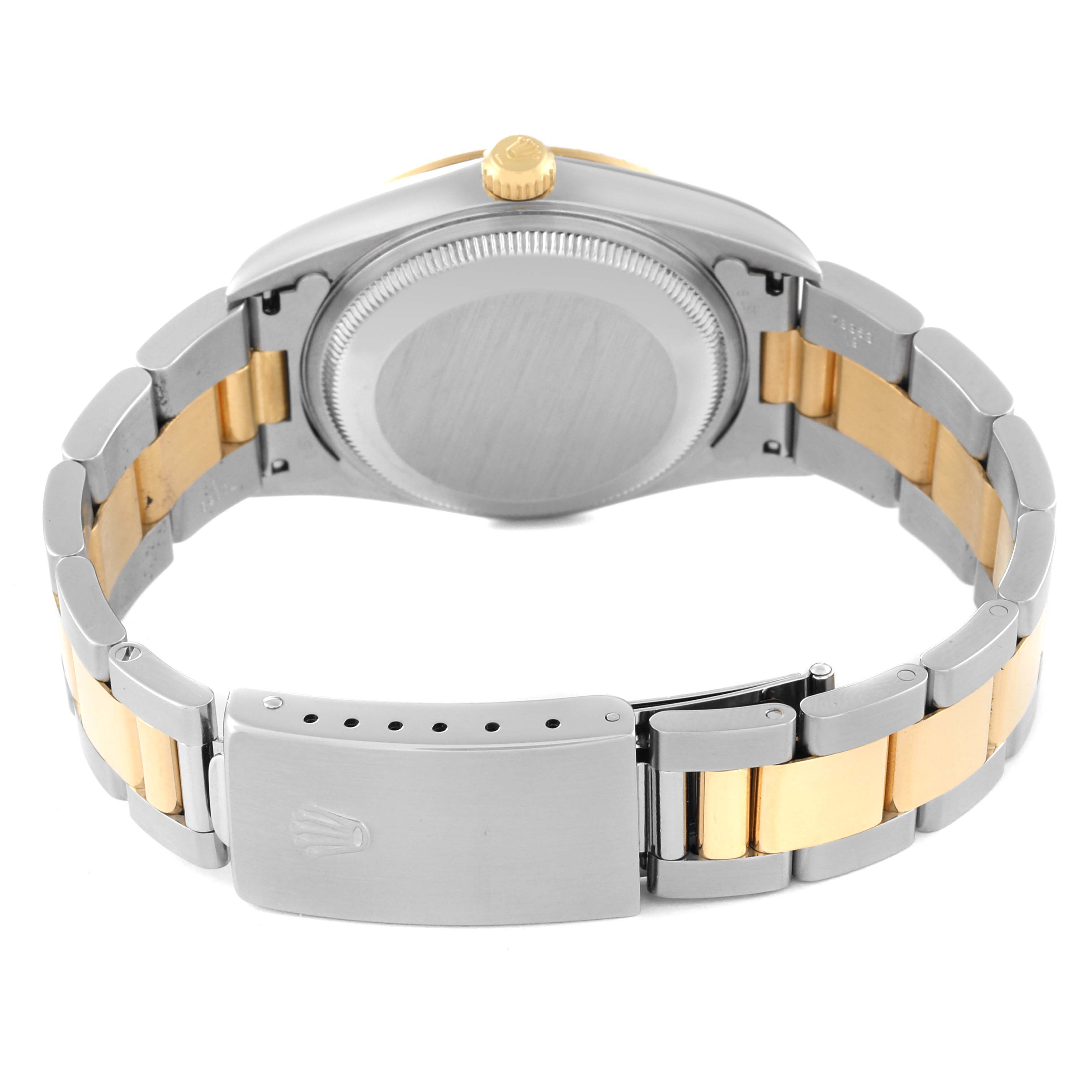 This image shows the back and bracelet of a Rolex Date 15223 Men's Steel and Gold (two tone) Champagne Dial 15223 Men's Steel and Gold (two tone) Champagne Dial model watch, highlighting the clasp and crown.