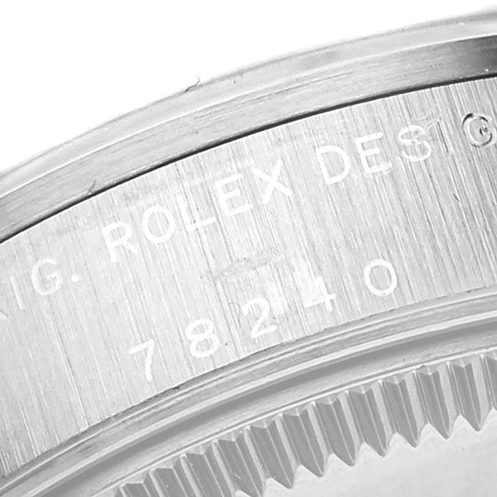 The image shows a close-up of the engraved case back of a Mid-Size Rolex watch, highlighting the brand and model number "78240".