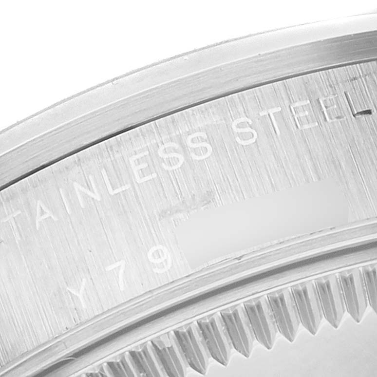This image shows a close-up of the stainless steel case back and serial number of a Rolex Mid-Size 78240 Women
s Stainless Steel Silver Dial 78240 Women
s Stainless Steel Silver Dial model watch.