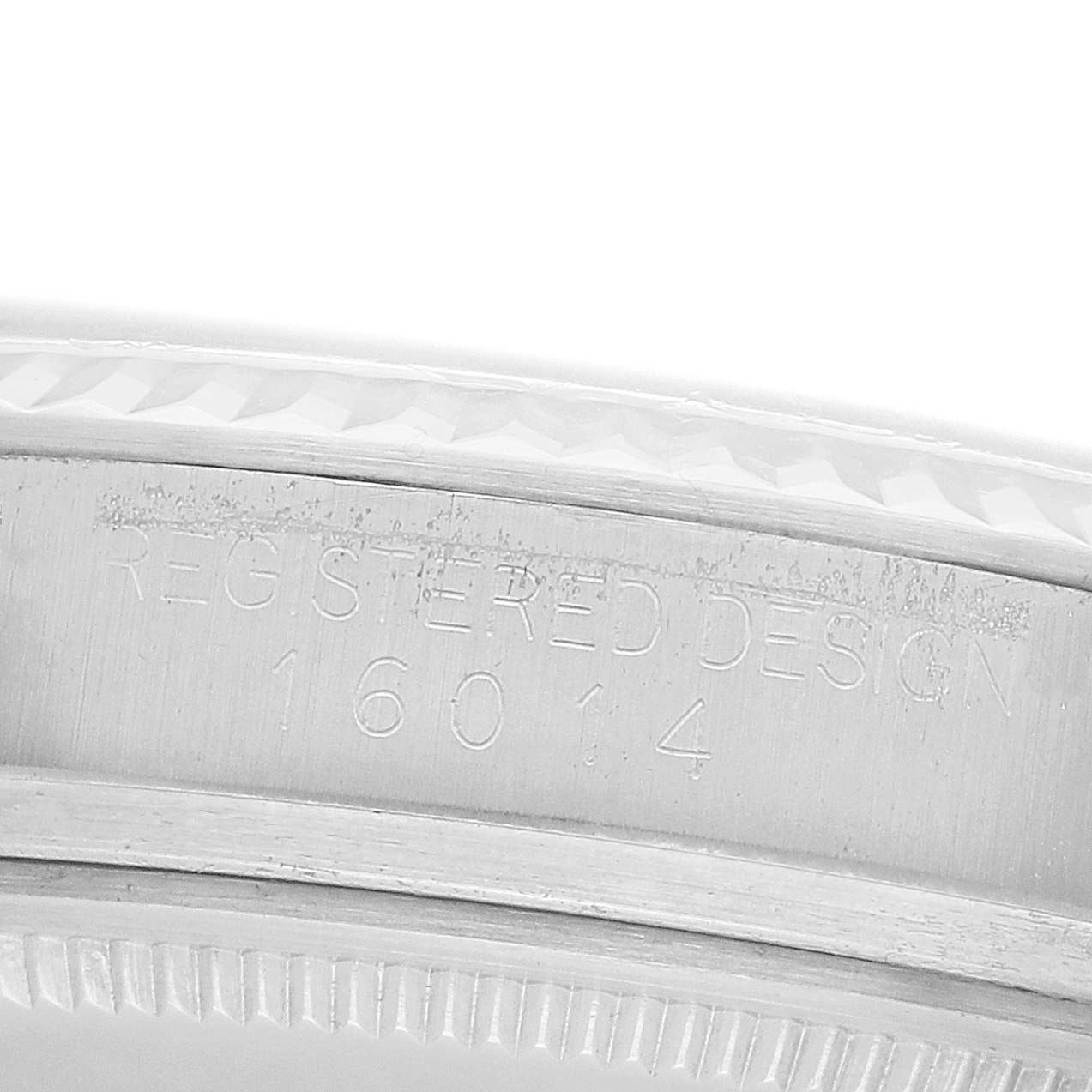 The image shows the inner case of a Rolex Datejust 16014 Men
s Stainless Steel Silver Dial, highlighting the engraved model number and design details.