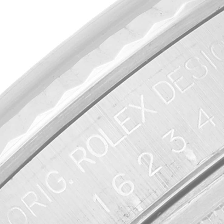This image shows a close-up angle of the bezel and engraved inner ring of a Rolex Datejust 16234 Men's Stainless Steel Silver Dial 16234 Men's Stainless Steel Silver Dial watch.