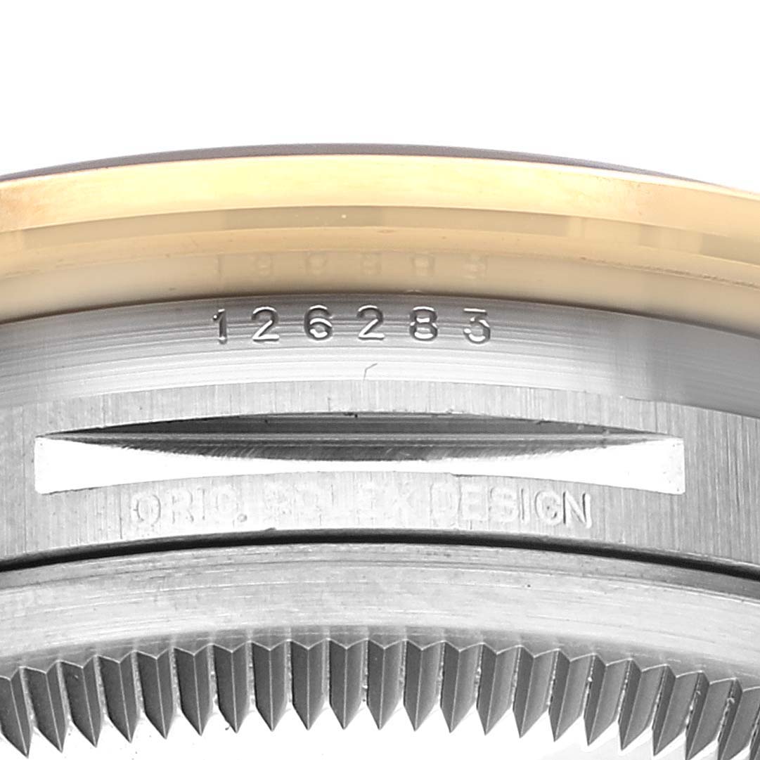 This close-up image of the Rolex Datejust 126283 Men's Steel and Gold (two tone) Grey Dial 126283 Men's Steel and Gold (two tone) Grey Dial watch shows the case, with visible model number and part of the bezel.