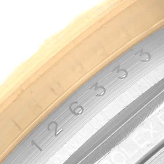 This close-up image shows the outer bezel and part of the dial with numerals of a Rolex Datejust 41 126333 Men's Steel and Gold (two tone) Champagne Dial 126333 Men's Steel and Gold (two tone) Champagne Dial watch.