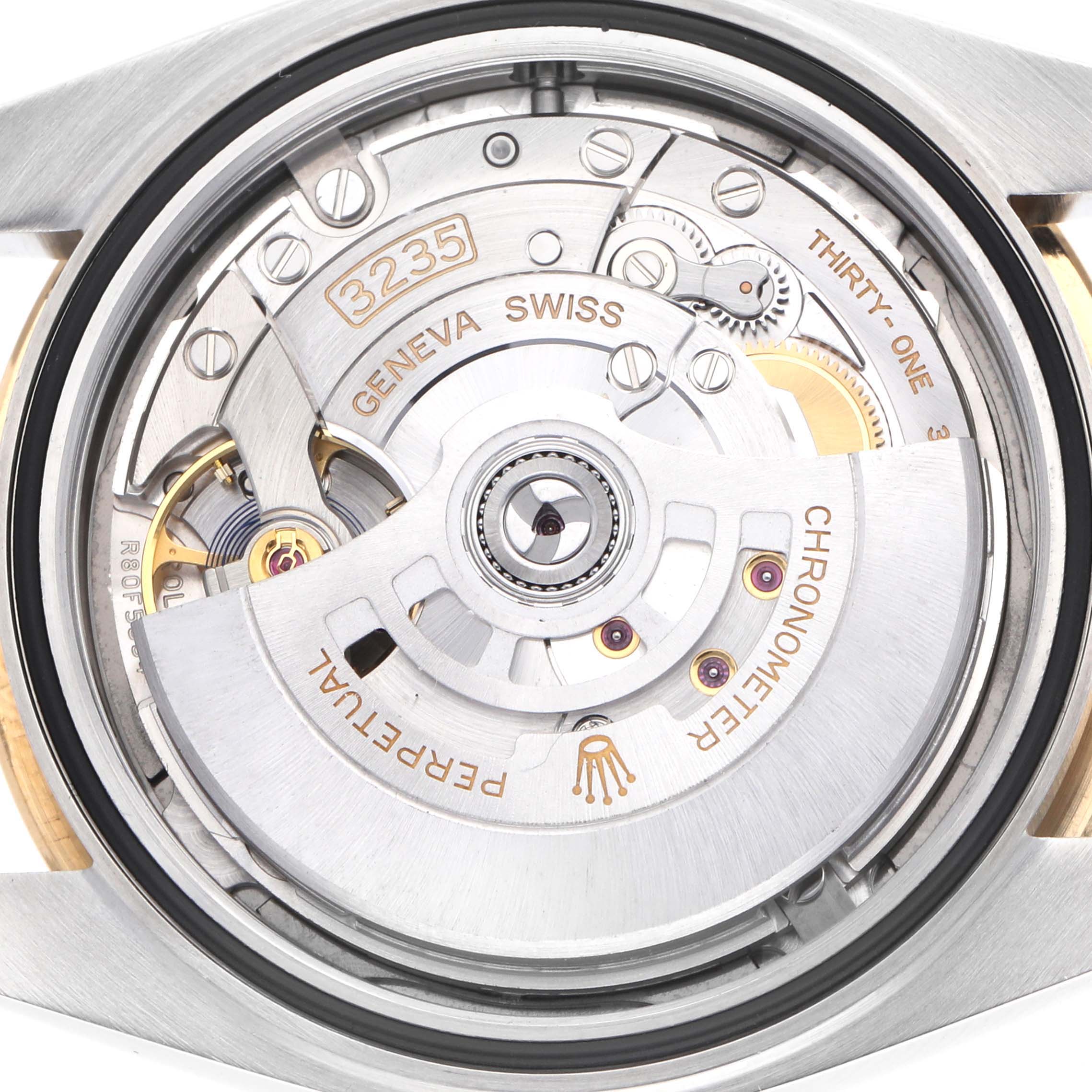 The image shows a close-up view of the Rolex Datejust 41 126333 Men
s Steel and Gold (two tone) Grey Dial
s movement, highlighting its intricate components.