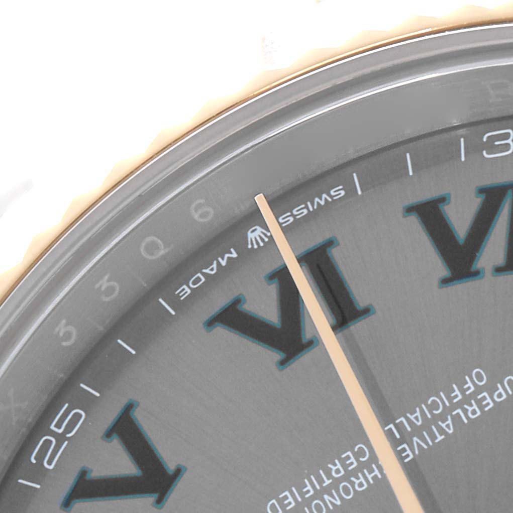 The image shows a close-up of the Rolex Datejust 41 126333 Men
s Steel and Gold (two tone) Grey Dial
s dial, highlighting the hour marker, partial bezel, and minute hand.