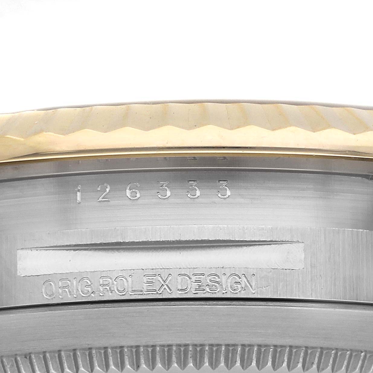 The image shows a close-up side view of the bezel and case edge of a Rolex Datejust 41 126333 Men
s Steel and Gold (two tone) Grey Dial, with engravings visible.