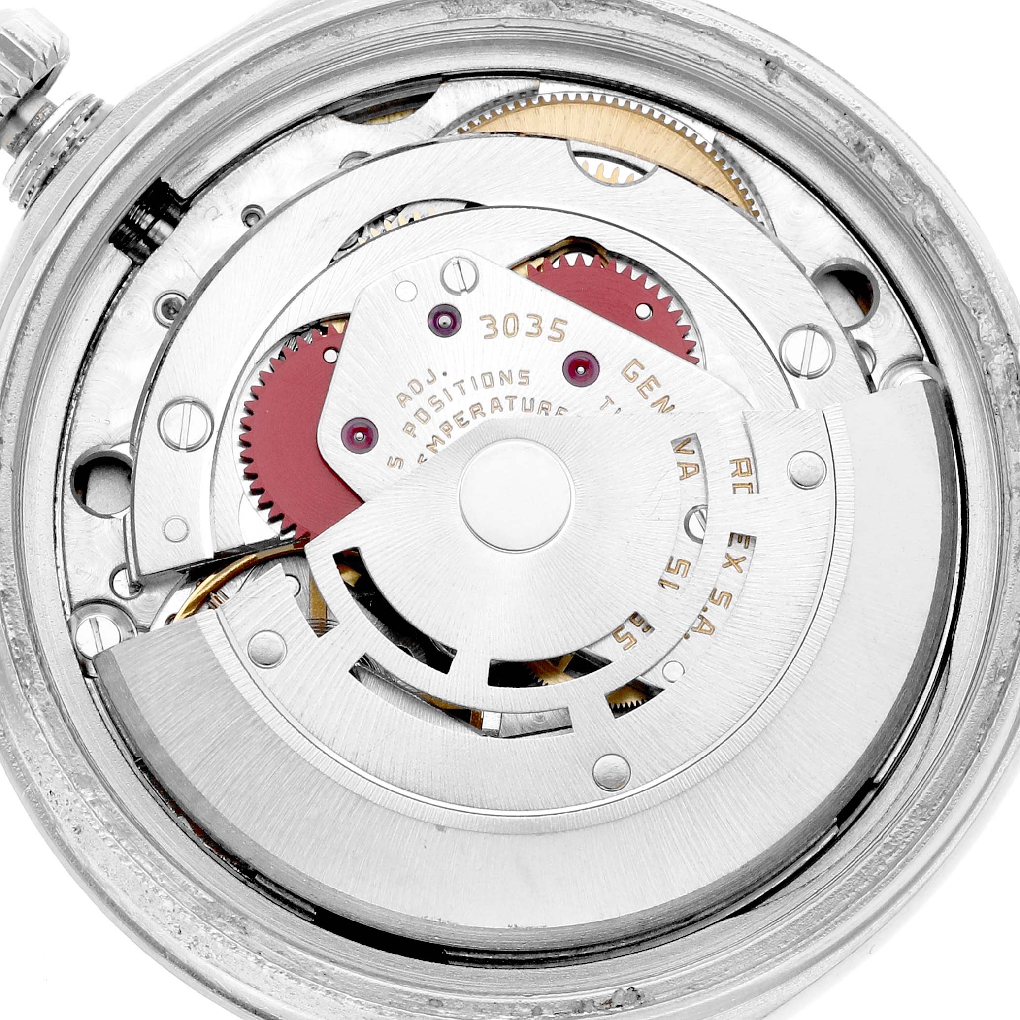 The image shows the movement of a Rolex Vintage Collection 16030 Men
s Stainless Steel Silver Dial watch from the back, highlighting gears and inscriptions.