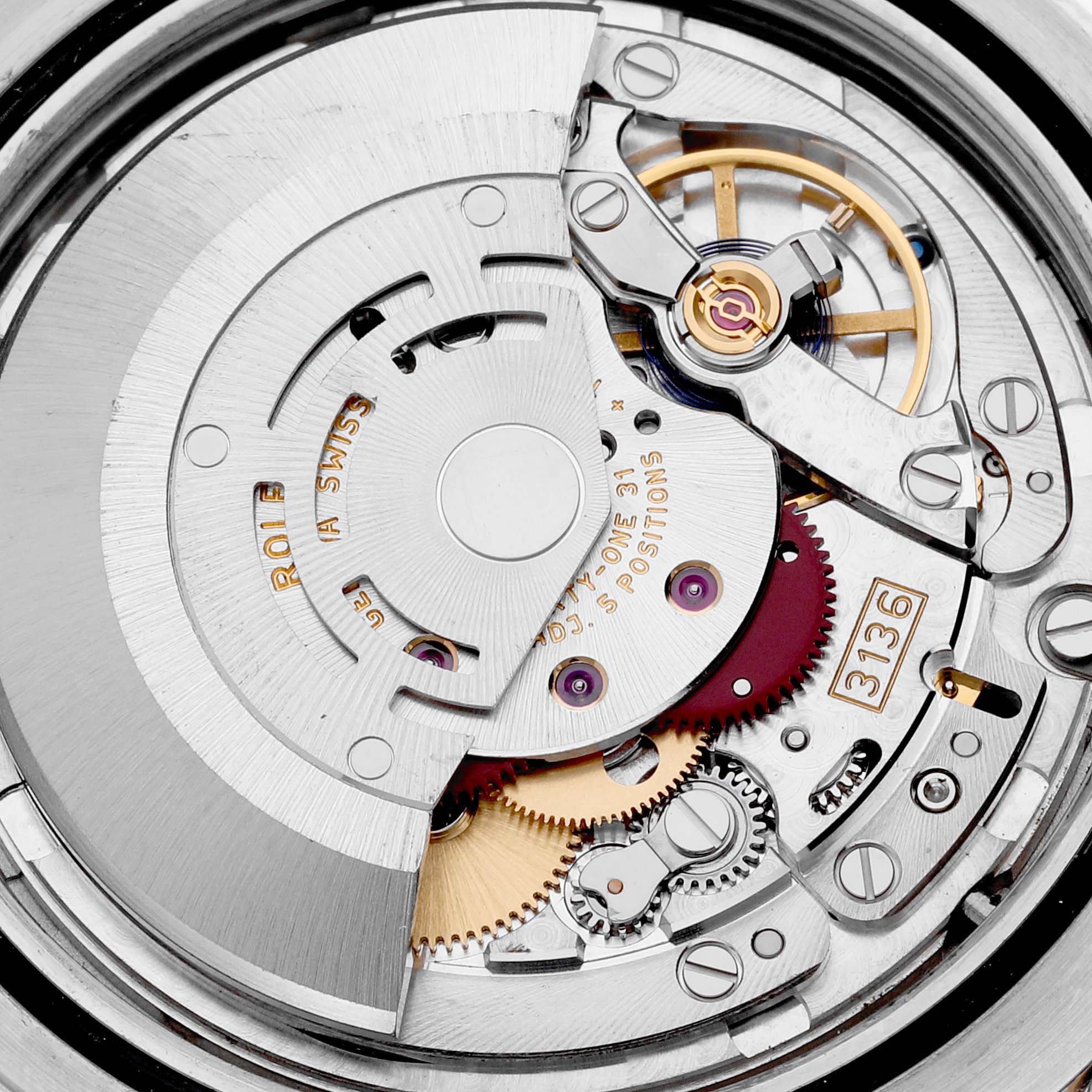 The image shows an up-close view of the movement mechanism of the Rolex Datejust 41 116333 Men's Steel and Gold (two tone) Black Dial 116333 Men's Steel and Gold (two tone) Black Dial, highlighting intricate gears and components.