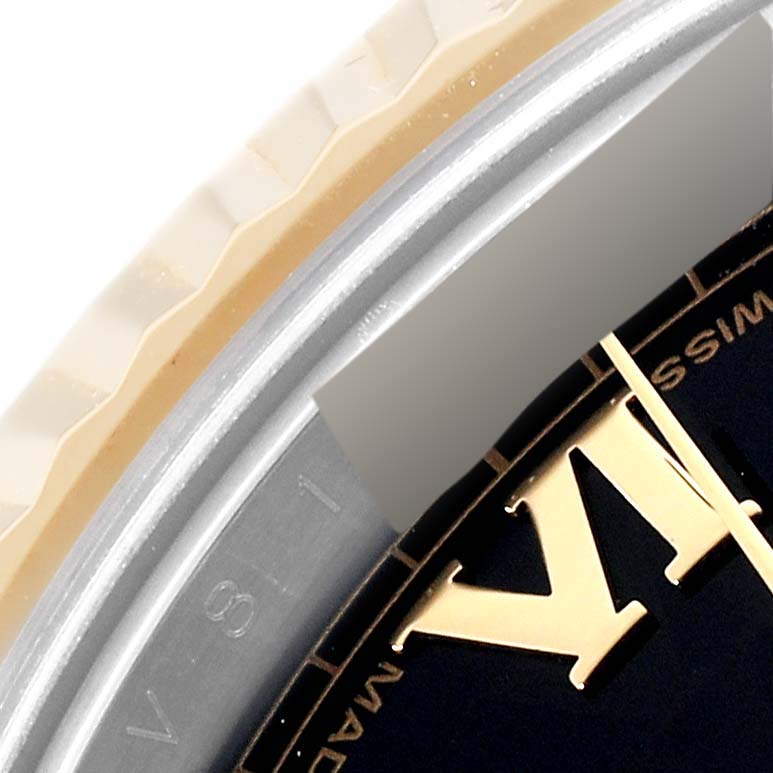 This image shows a close-up of the edge of the dial and part of the bezel of a Rolex Datejust 41 116333 Men's Steel and Gold (two tone) Black Dial 116333 Men's Steel and Gold (two tone) Black Dial watch.