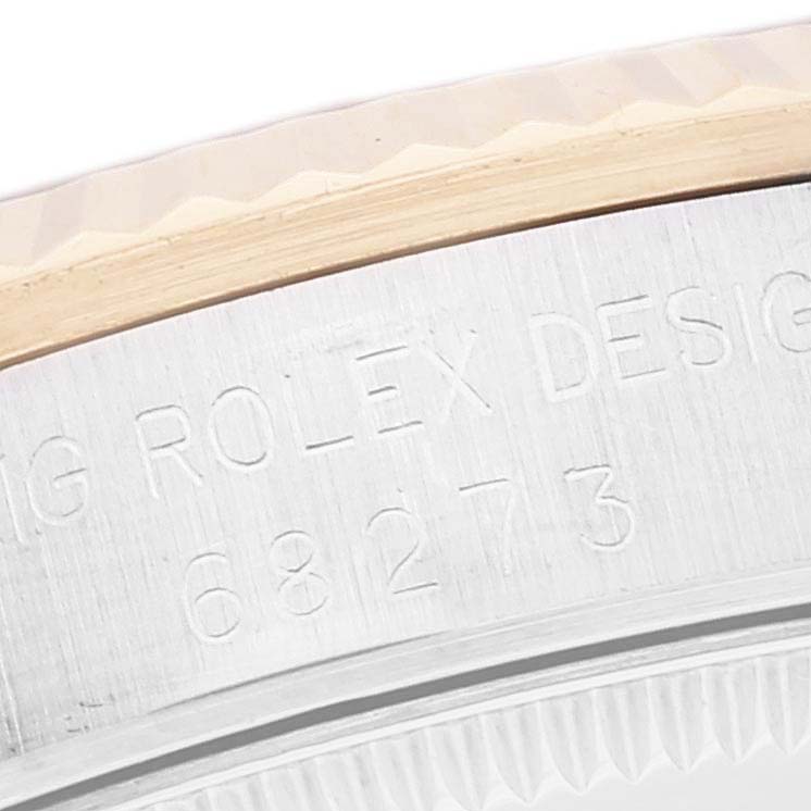 The close-up image shows the case side and bezel of a Mid-Size Rolex watch, displaying the brand
s engraving.