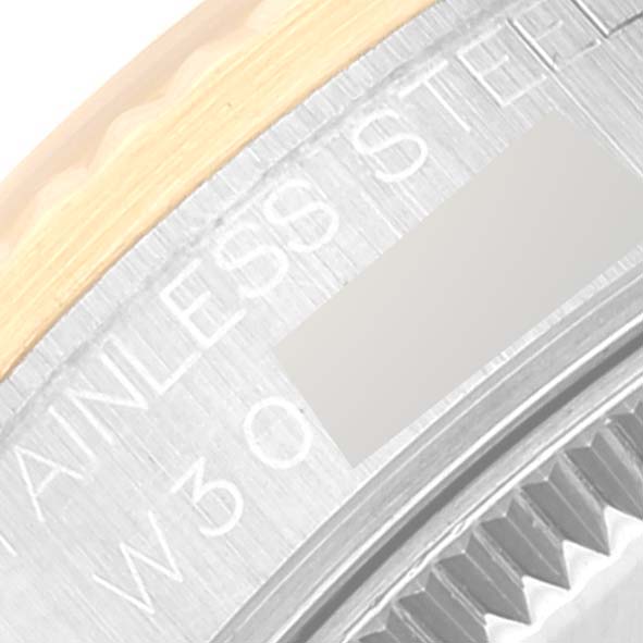 The image shows a close-up of the edge of the back casing of a Mid-Size Rolex watch, highlighting the stainless steel and some etched text.