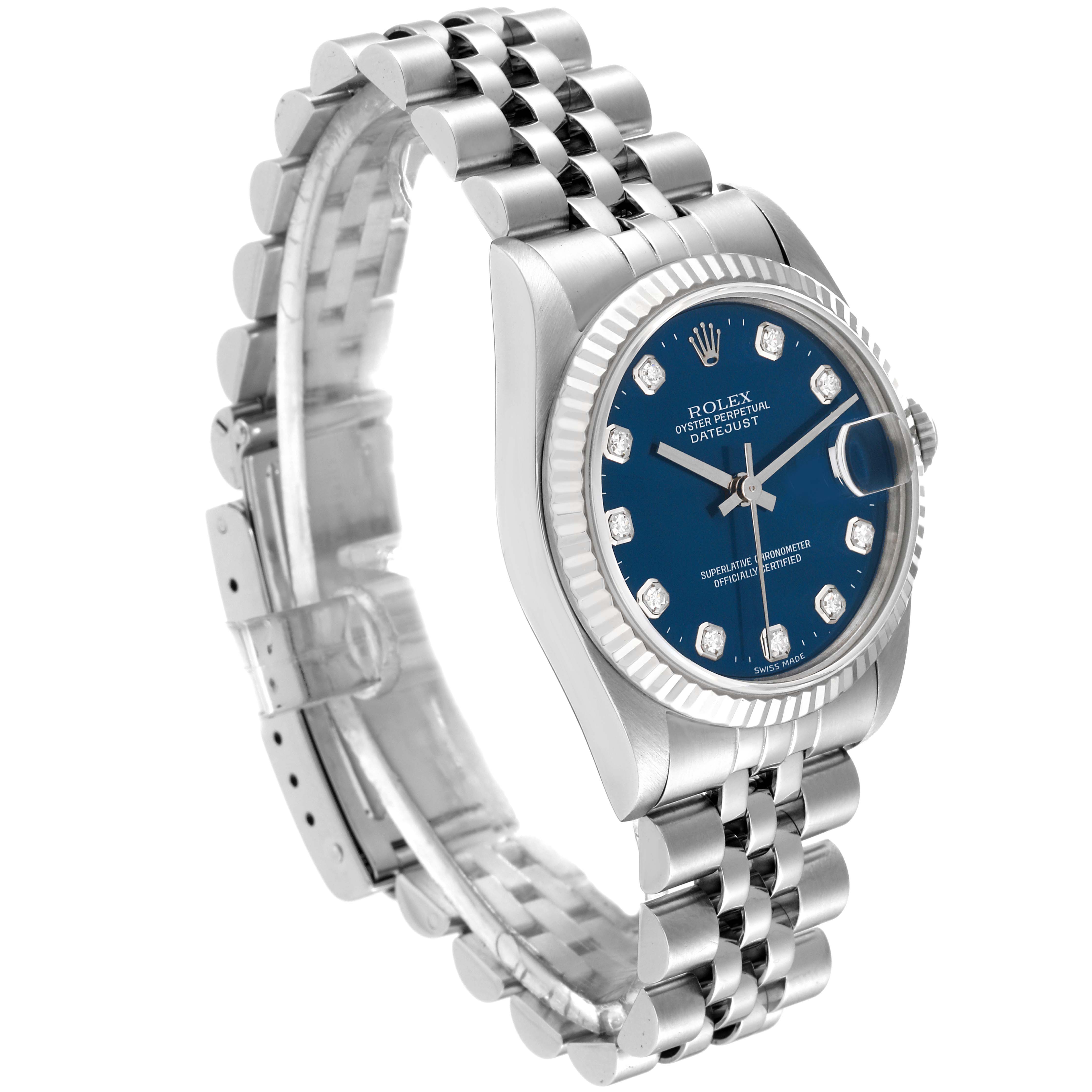 This Rolex Mid-Size 68274 Women
s Stainless Steel Blue Dial 68274 Women
s Stainless Steel Blue Dial watch is shown from an angled side view, displaying its blue dial, bezel, crown, and Jubilee bracelet.
