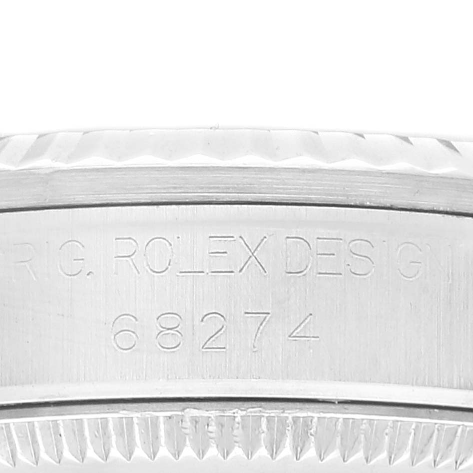 This image shows the side view of the bezel and the case with the engraved model number "68274" of a Mid-Size Rolex watch.