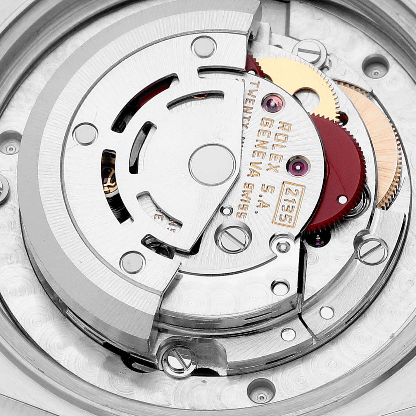 This image shows a close-up of the movement parts inside a Mid-Size Rolex watch.
