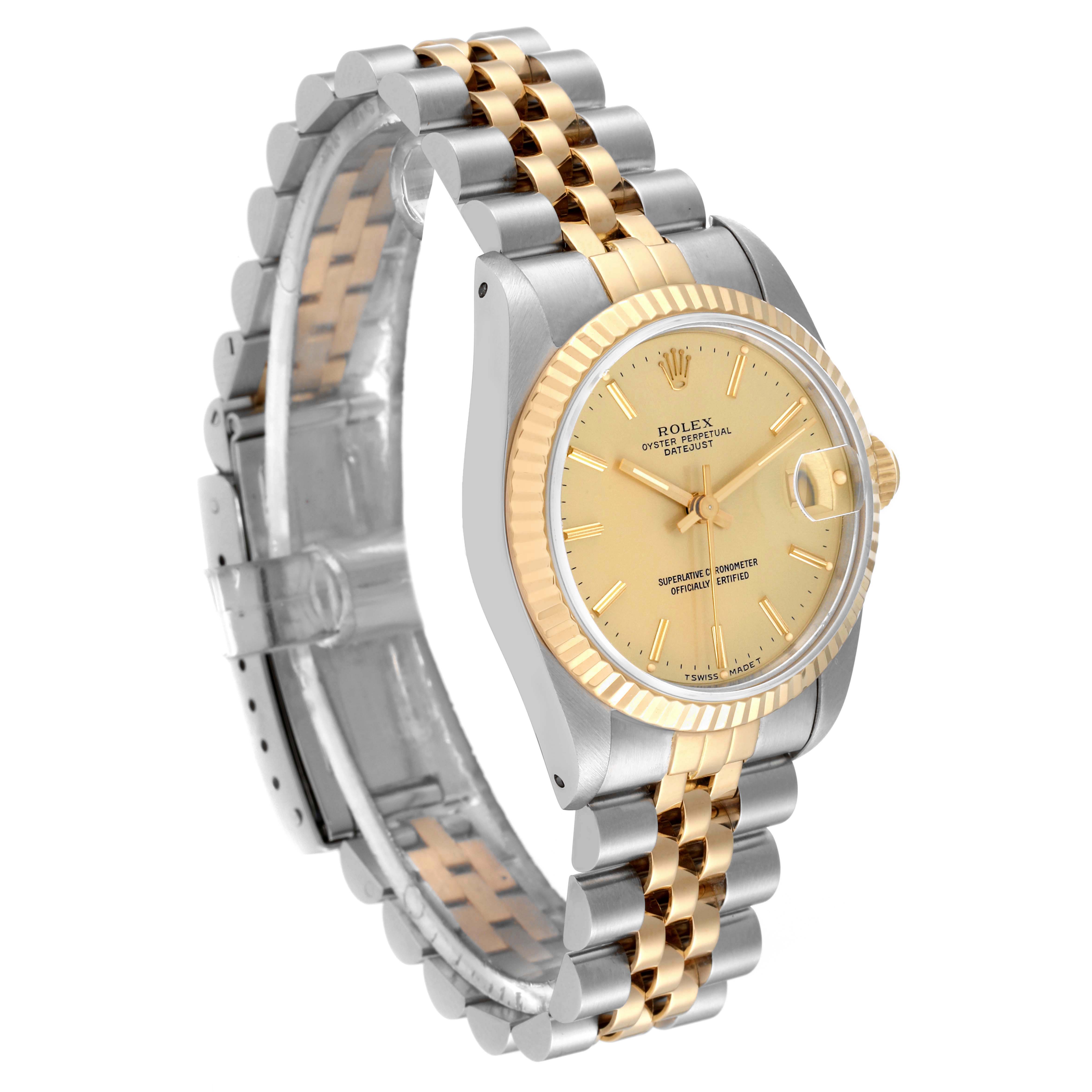 The image shows a side view of a Mid-Size Rolex Datejust watch, highlighting its two-tone metal bracelet and gold dial.