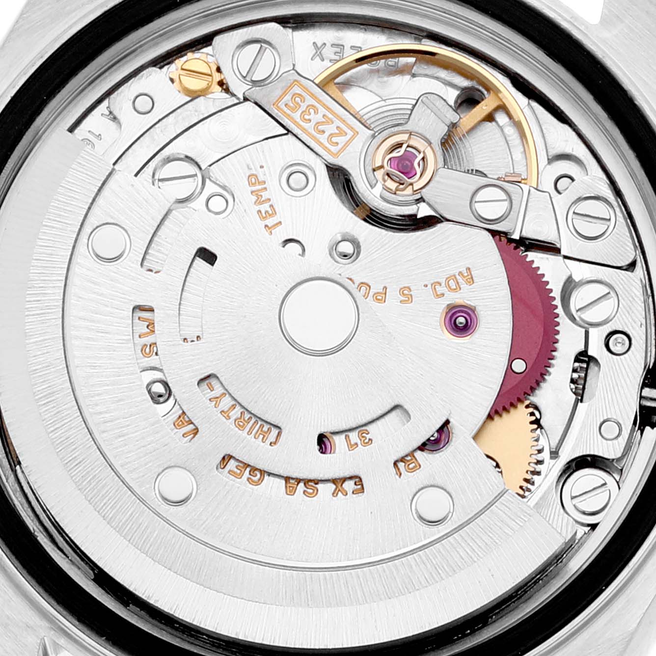 This image shows the intricate inner mechanism of a Rolex Datejust 79174 Women's Stainless Steel Mother of Pearl Dial 79174 Women's Stainless Steel Mother of Pearl Dial watch, highlighting gears, screws, and the rotor.
