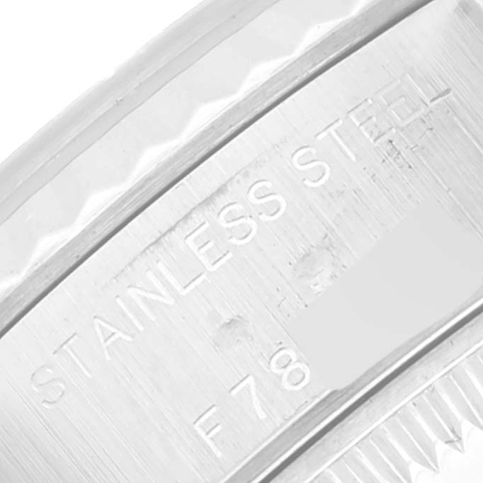The image shows a close-up of the stainless steel bezel and engraving on the Rolex Datejust 79174 Women's Stainless Steel Mother of Pearl Dial 79174 Women's Stainless Steel Mother of Pearl Dial watch.