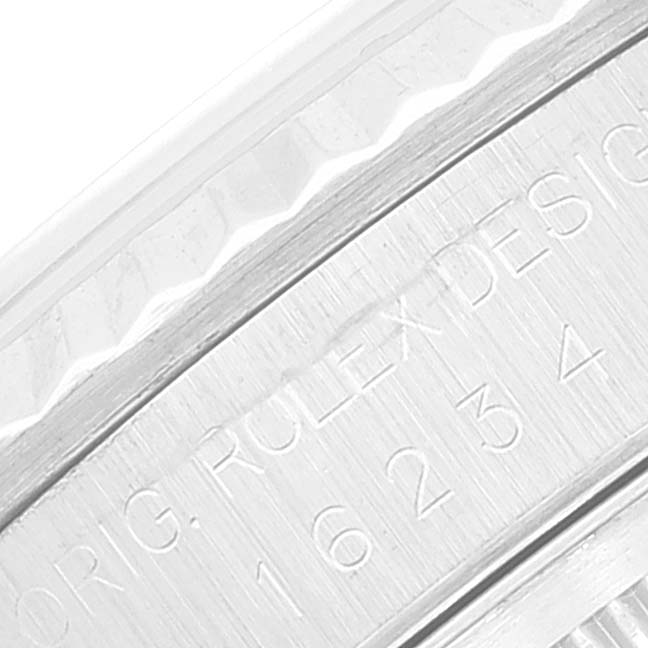 This image shows a close-up of the engraved case-back edge of a Rolex Datejust 16234 Men's Stainless Steel Silver Dial 16234 Men's Stainless Steel Silver Dial watch.