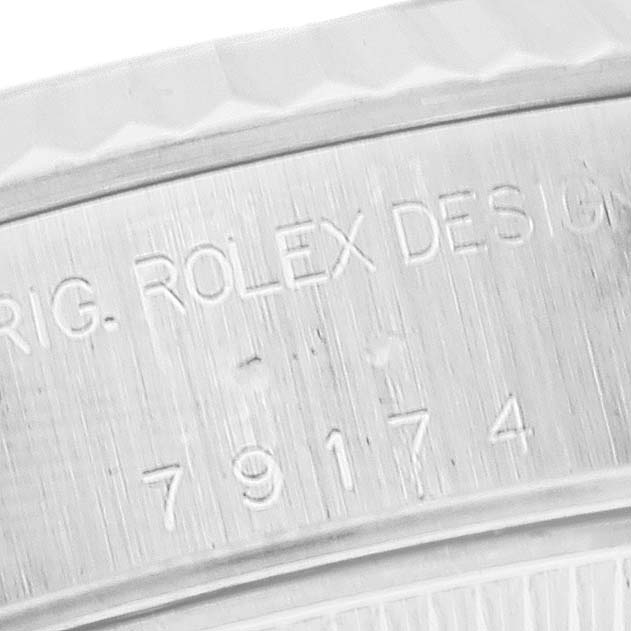 The image shows a close-up angle revealing the serial number and part of the bezel of a Rolex Datejust 79174 Women's Stainless Steel White Dial 79174 Women's Stainless Steel White Dial watch.