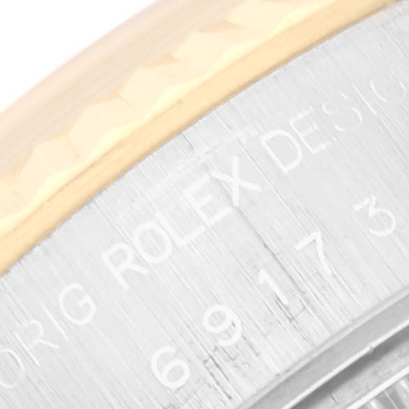 The image shows a close-up of the case side and bezel of a Rolex Datejust 69173 Women's Steel and Gold (two tone) Champagne Dial 69173 Women's Steel and Gold (two tone) Champagne Dial watch.