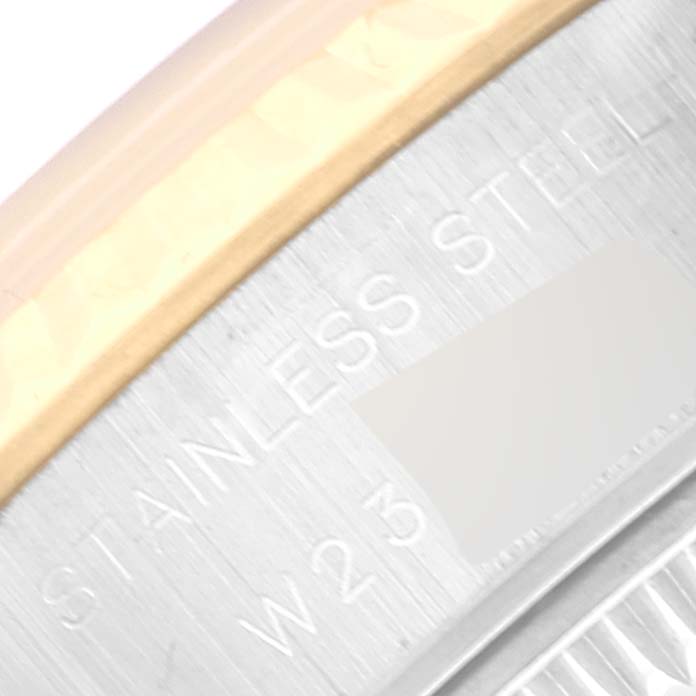 The image shows a close-up of the side of a Rolex Datejust 69173 Women's Steel and Gold (two tone) Champagne Dial 69173 Women's Steel and Gold (two tone) Champagne Dial, highlighting the "Stainless Steel" engraving.