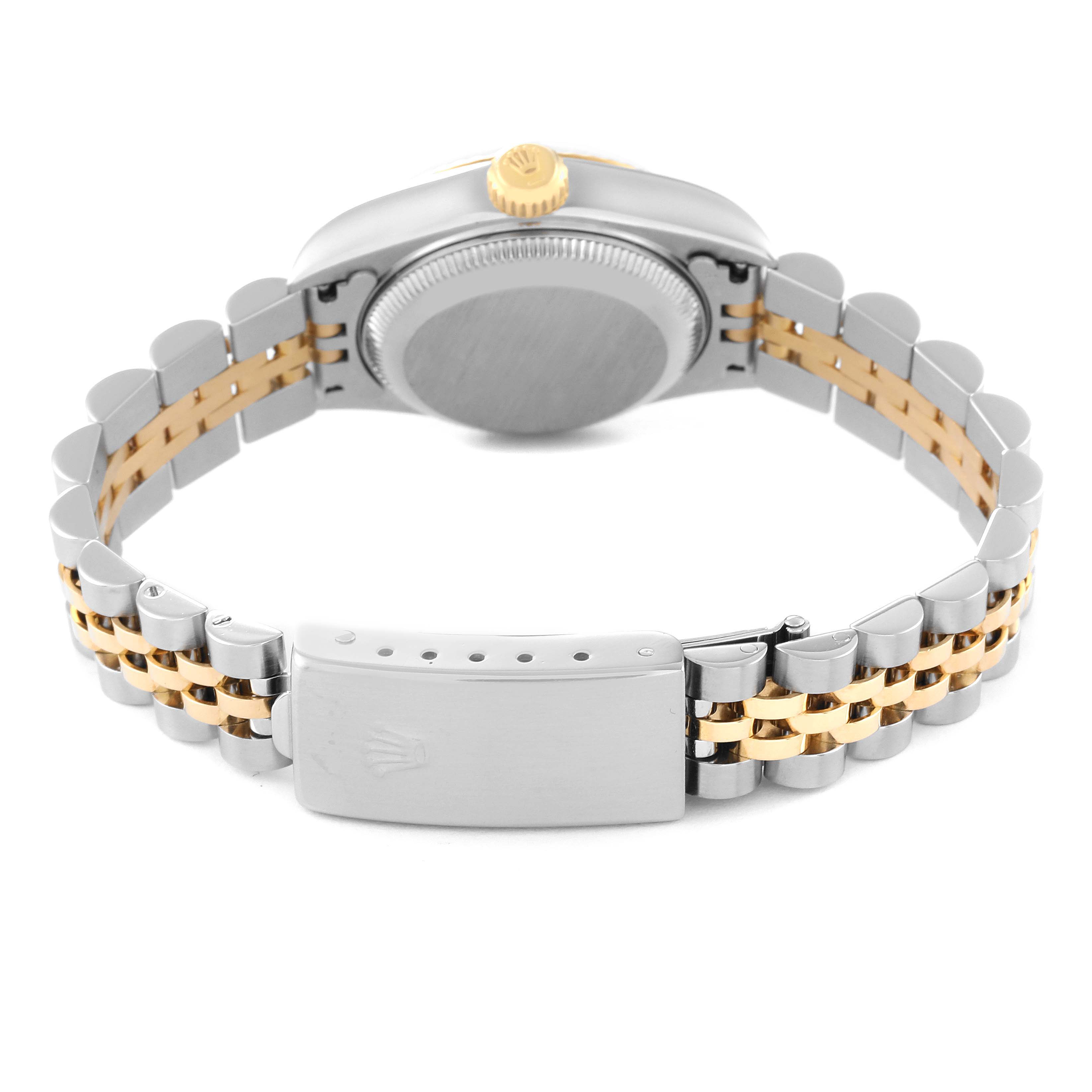 The image shows the back view of a Rolex Datejust 79173 Women's Steel and Gold (two tone) Champagne Dial 79173 Women's Steel and Gold (two tone) Champagne Dial watch, highlighting its clasp, bracelet, case back, and winding crown.