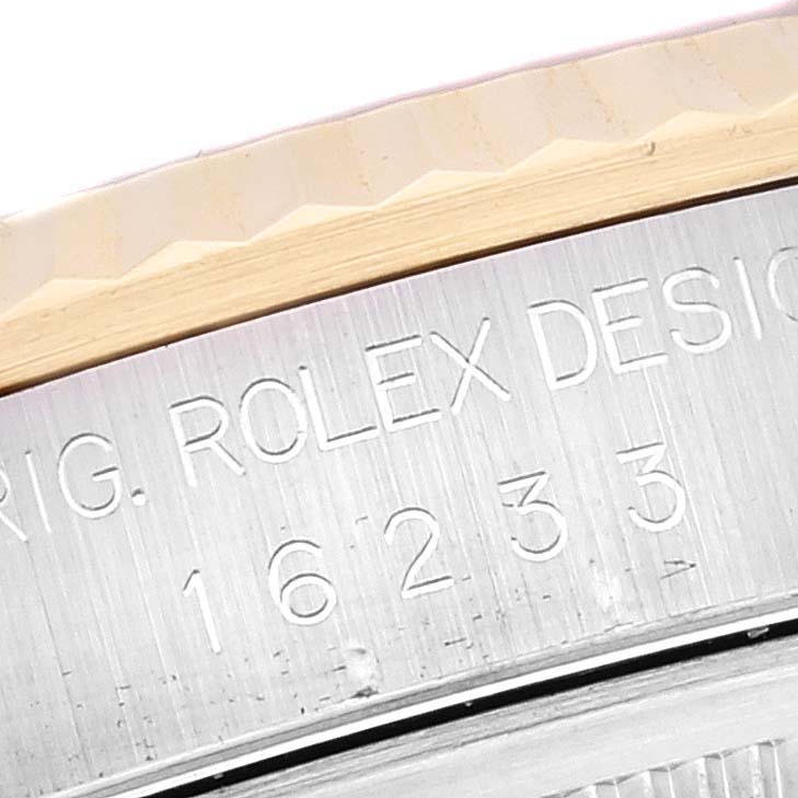 This image shows a close-up of the engraved case reference number and design details of the Rolex Datejust 16233 Men's Steel and Gold (two tone) White Dial 16233 Men's Steel and Gold (two tone) White Dial model.