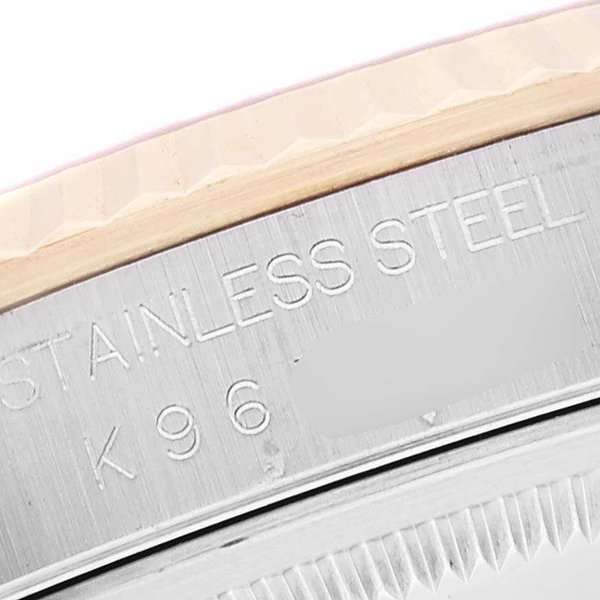 This close-up image shows the side of the bezel and case with "STAINLESS STEEL" engraving on a Rolex Datejust 16233 Men's Steel and Gold (two tone) White Dial 16233 Men's Steel and Gold (two tone) White Dial watch.