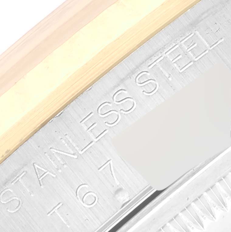 This image shows a close-up of the side of a Rolex Datejust 16233 Men's Steel and Gold (two tone) White Dial 16233 Men's Steel and Gold (two tone) White Dial watch, highlighting the stainless steel engraving.