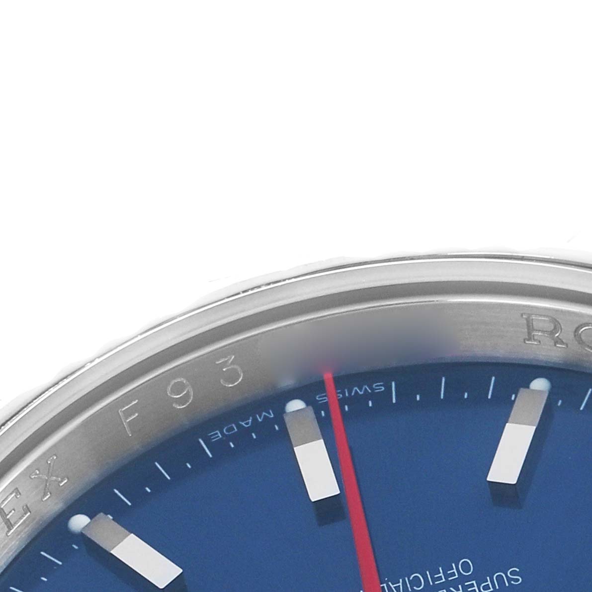 The image shows a partial view of a Rolex Datejust 116264 Men
s Stainless Steel Blue Dial, highlighting the blue dial, markers, and part of the bezel with engravings.