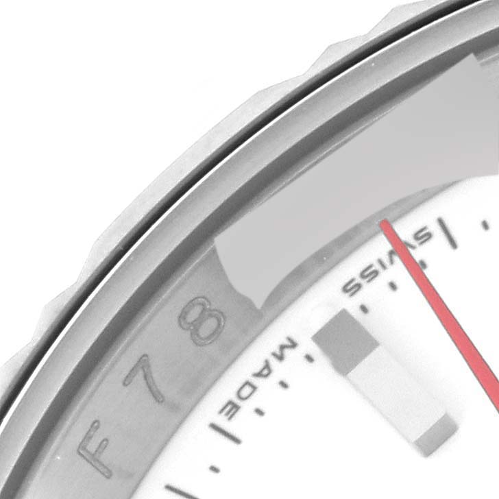 This image captures a close-up of the bezel, part of the dial, and minute hand of a Turn-o-Graph model by Rolex.