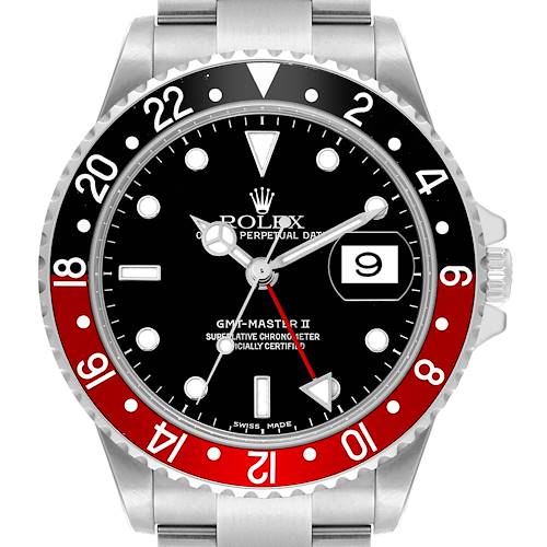 The Rolex GMT-Master II watch is shown from the front, highlighting the bezel, dial, hands, and date window.