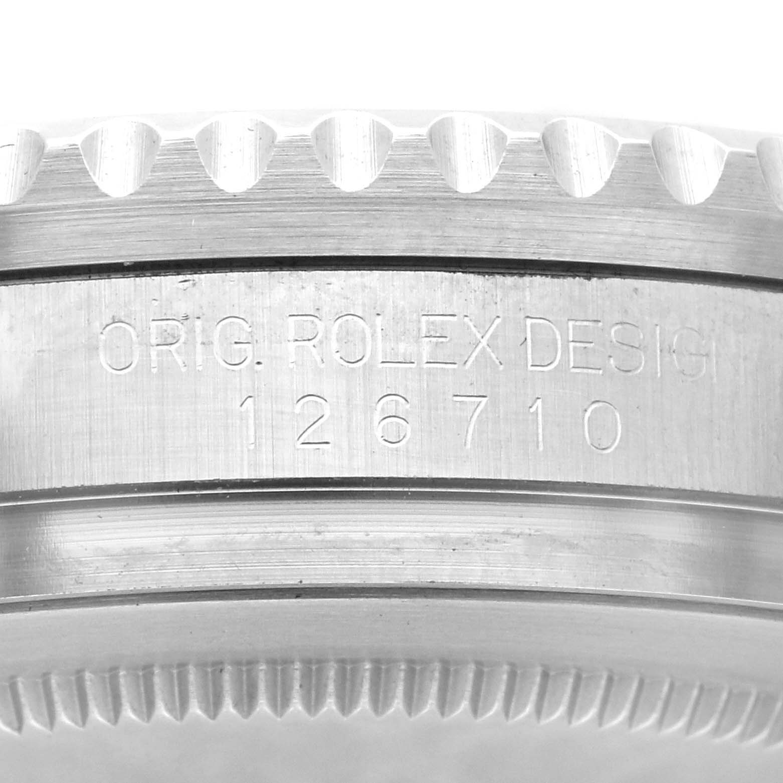 The image shows a close-up of the side case, bezel, and serial engraving of a Rolex GMT-Master 126710BLRO Men's Stainless Steel Black Dial 126710BLRO Men's Stainless Steel Black Dial watch.