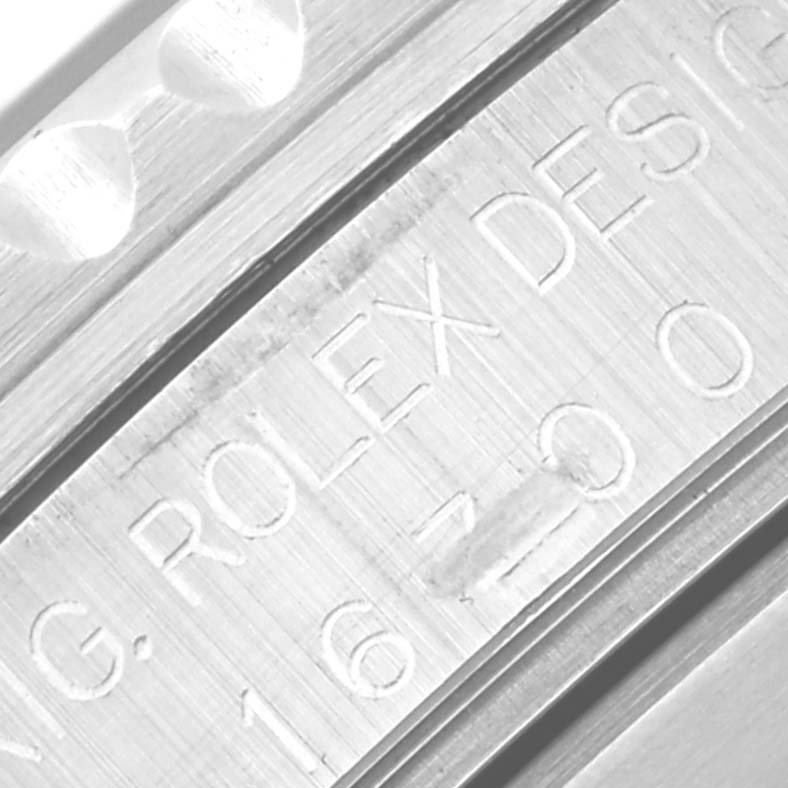 The image shows a close-up of the engraving on the case of the Rolex GMT-Master 16700 Men
s Stainless Steel Black Dial 16700 Men
s Stainless Steel Black Dial, displaying model details.