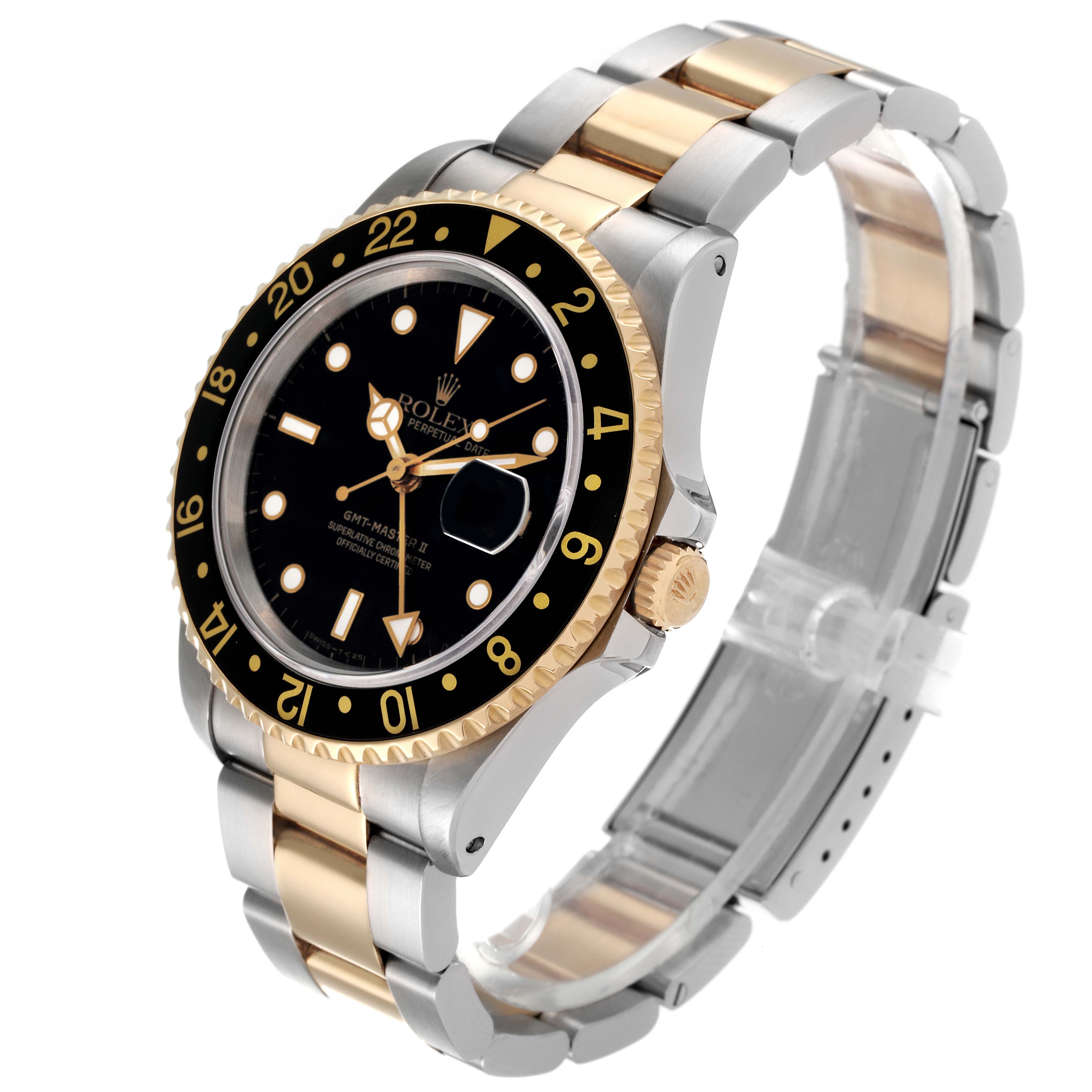 This image shows the right side and the front of a Rolex GMT-Master 16713 Men
s Steel and Gold (two tone) Black Dial 16713 Men
s Steel and Gold (two tone) Black Dial watch, highlighting its black bezel, dial, and two-tone bracelet.