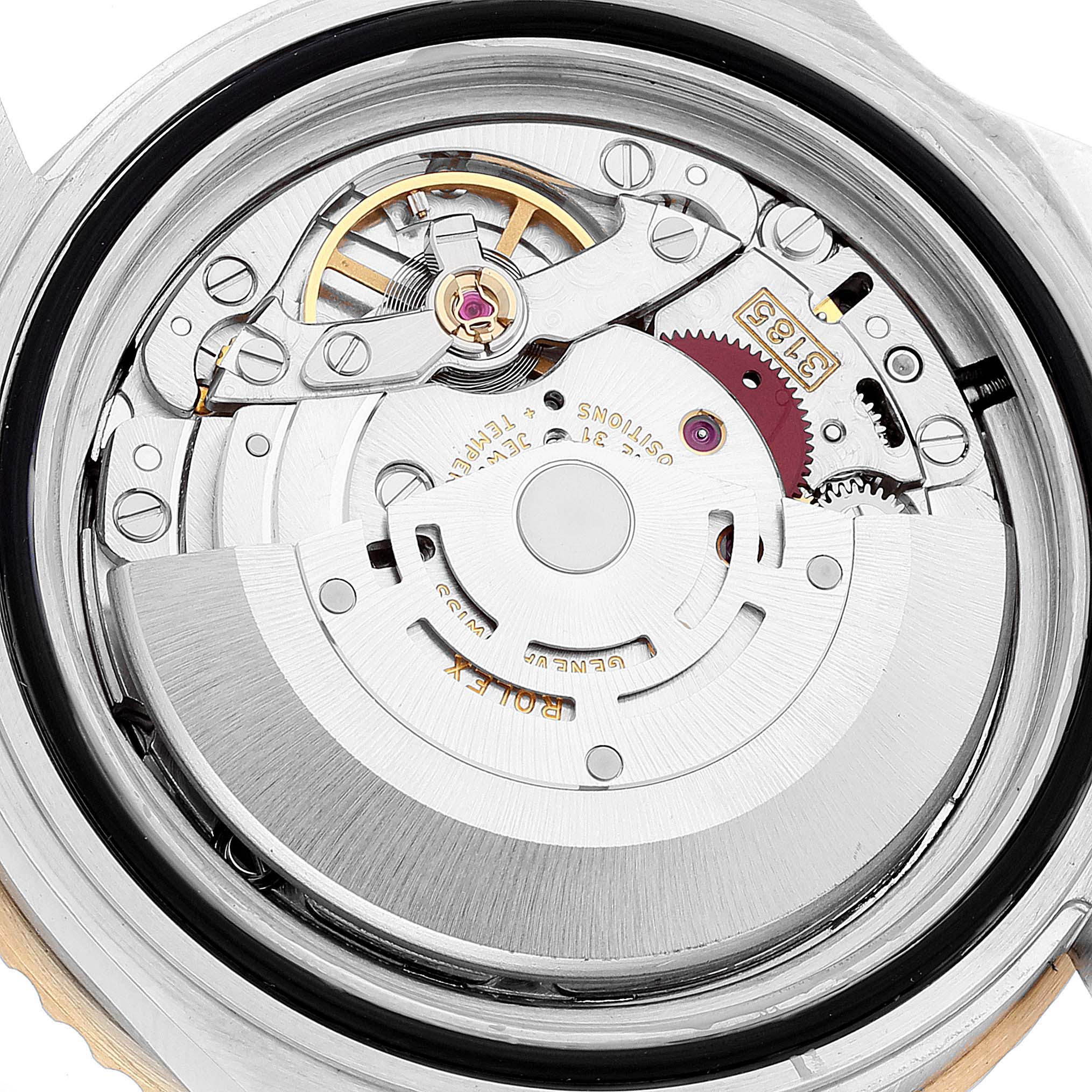 The image shows the intricate internal movement mechanism of a Rolex GMT-Master 16713 Men
s Steel and Gold (two tone) Black Dial 16713 Men
s Steel and Gold (two tone) Black Dial watch from a top-down angle.