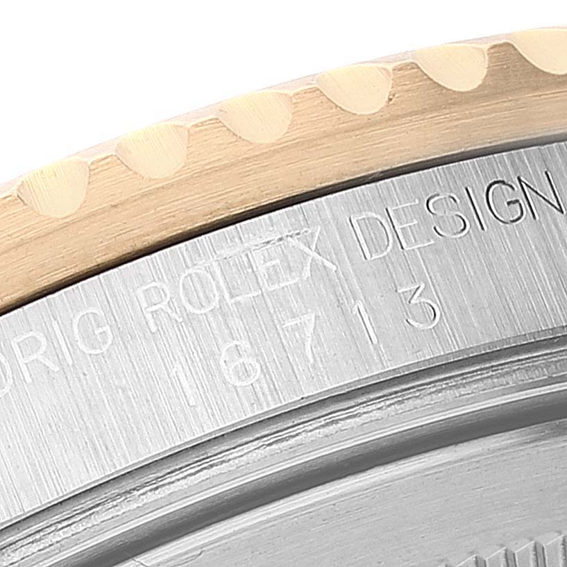 This close-up image shows the engraved back of a Rolex GMT-Master 16713 Men
s Steel and Gold (two tone) Black Dial 16713 Men
s Steel and Gold (two tone) Black Dial watch, highlighting the model number "16713."