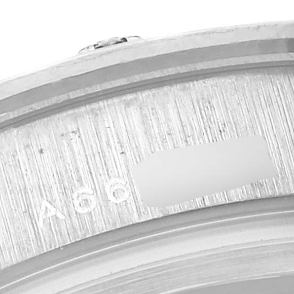 This image shows a close-up of the edge of the bezel and engraved markings on a Rolex Pearlmaster 80319 Women's White Gold Mother of Pearl Dial 80319 Women's White Gold Mother of Pearl Dial watch.