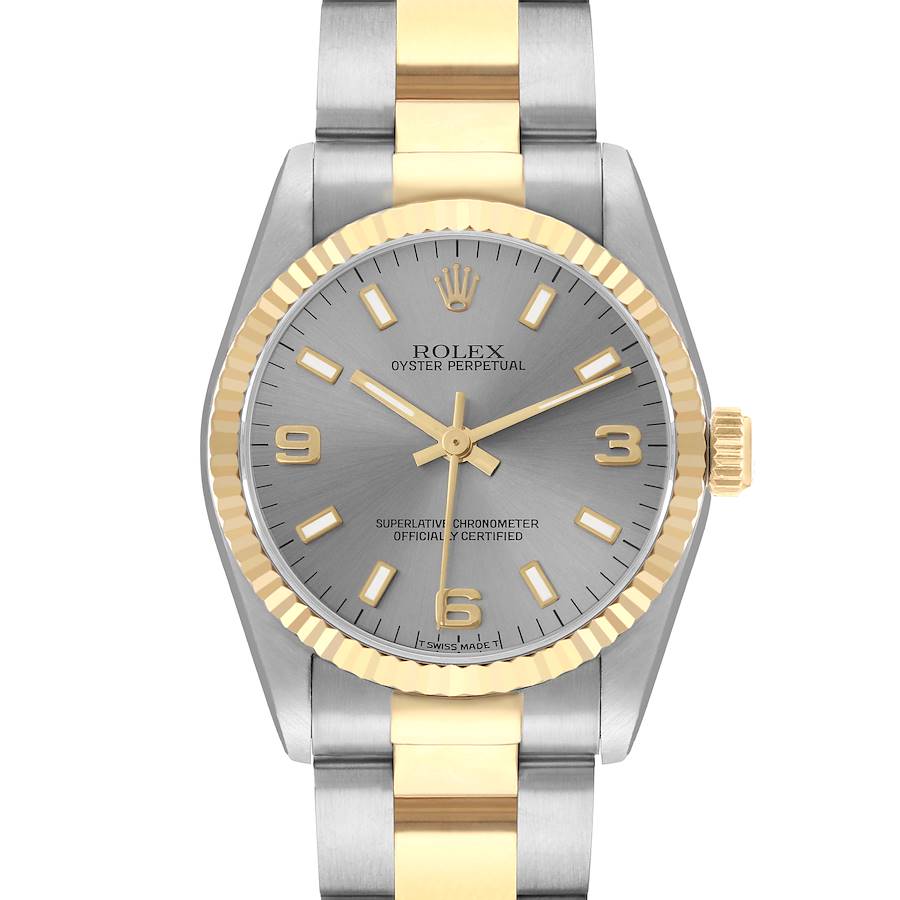 The Rolex Oyster Perpetual 67513 Women's Steel and Gold (two tone) Silver Dial watch is shown from a front angle, displaying its silver and gold bezel, dial, and bracelet.