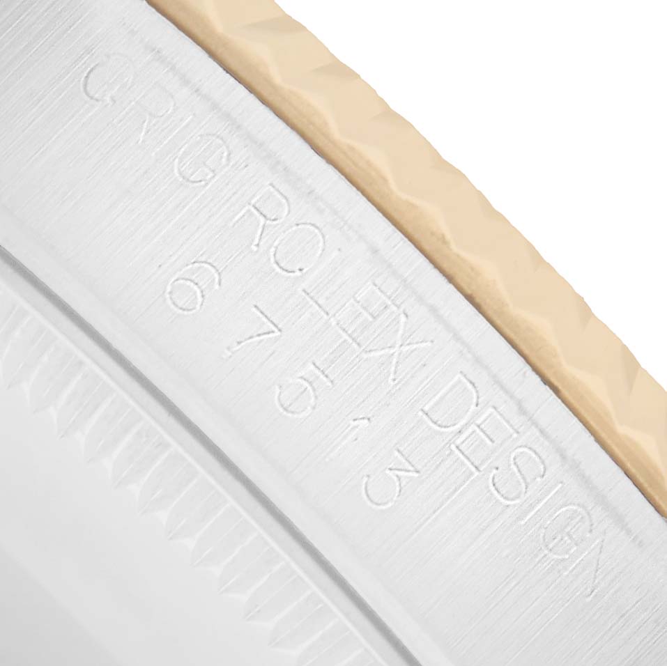 The image shows a close-up of the case edge and part of the bezel of a Rolex Oyster Perpetual 67513 Women
s Steel and Gold (two tone) Silver Dial watch, highlighting the engraved design reference.