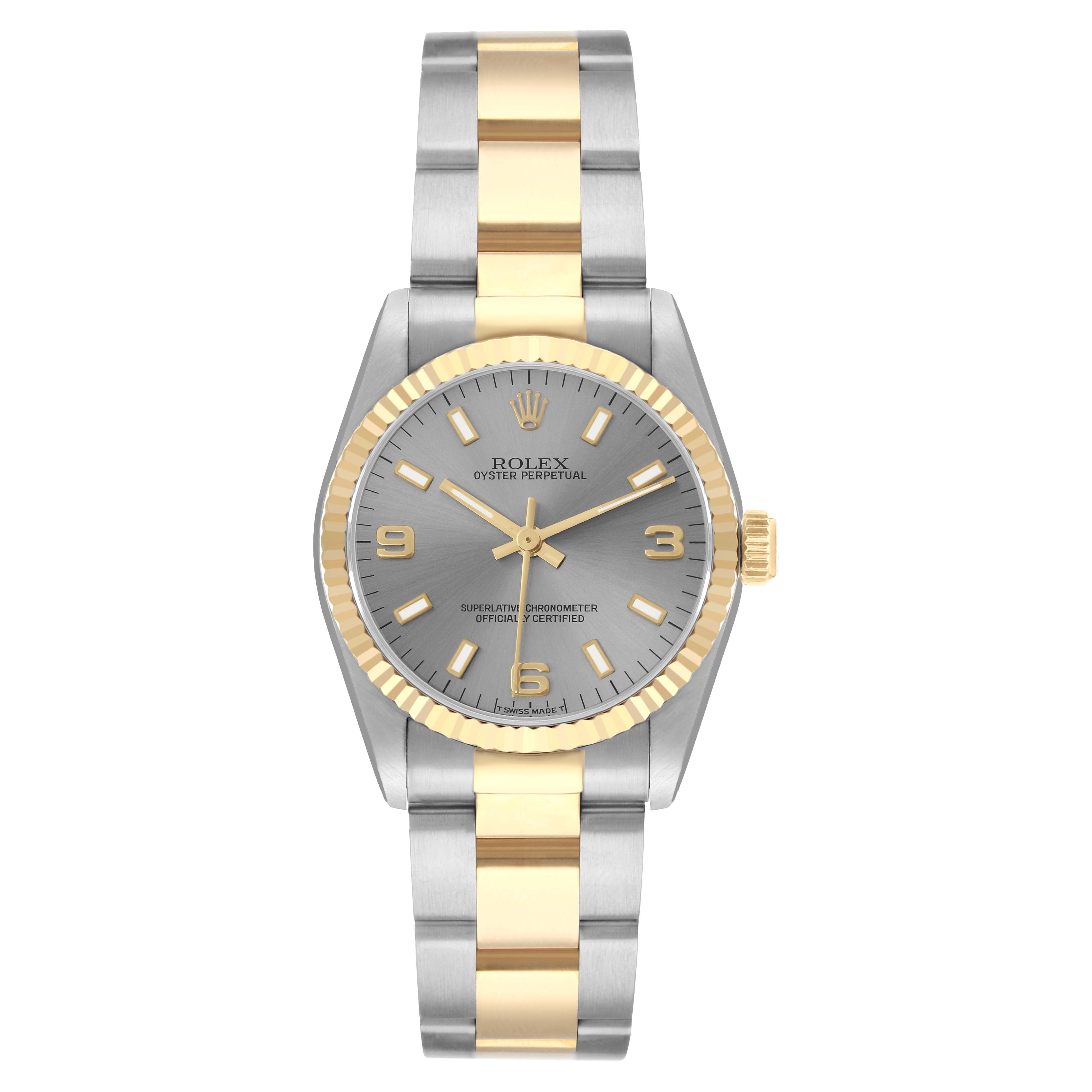 The Rolex Oyster Perpetual 67513 Women
s Steel and Gold (two tone) Silver Dial watch is shown from a top-down angle, displaying the face, bezel, and bracelet.