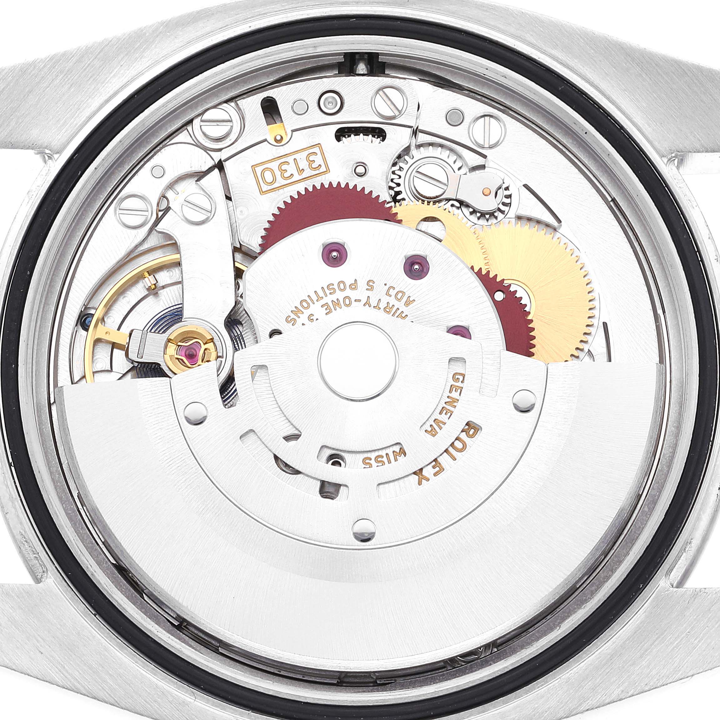 The image shows the internal mechanism of a Rolex Oyster Perpetual 116000 Men's Stainless Steel White Dial 116000 Men's Stainless Steel White Dial model watch viewed from the back.